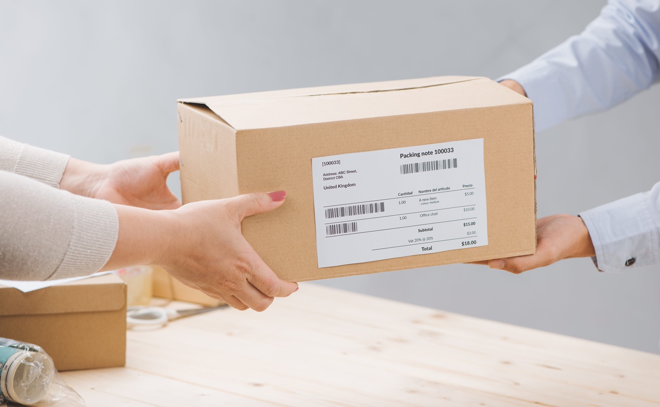 Woman receiving package from a delivery man